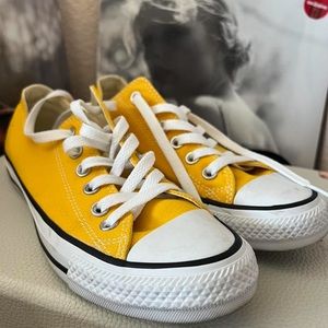 Yellow and white Converse trainers